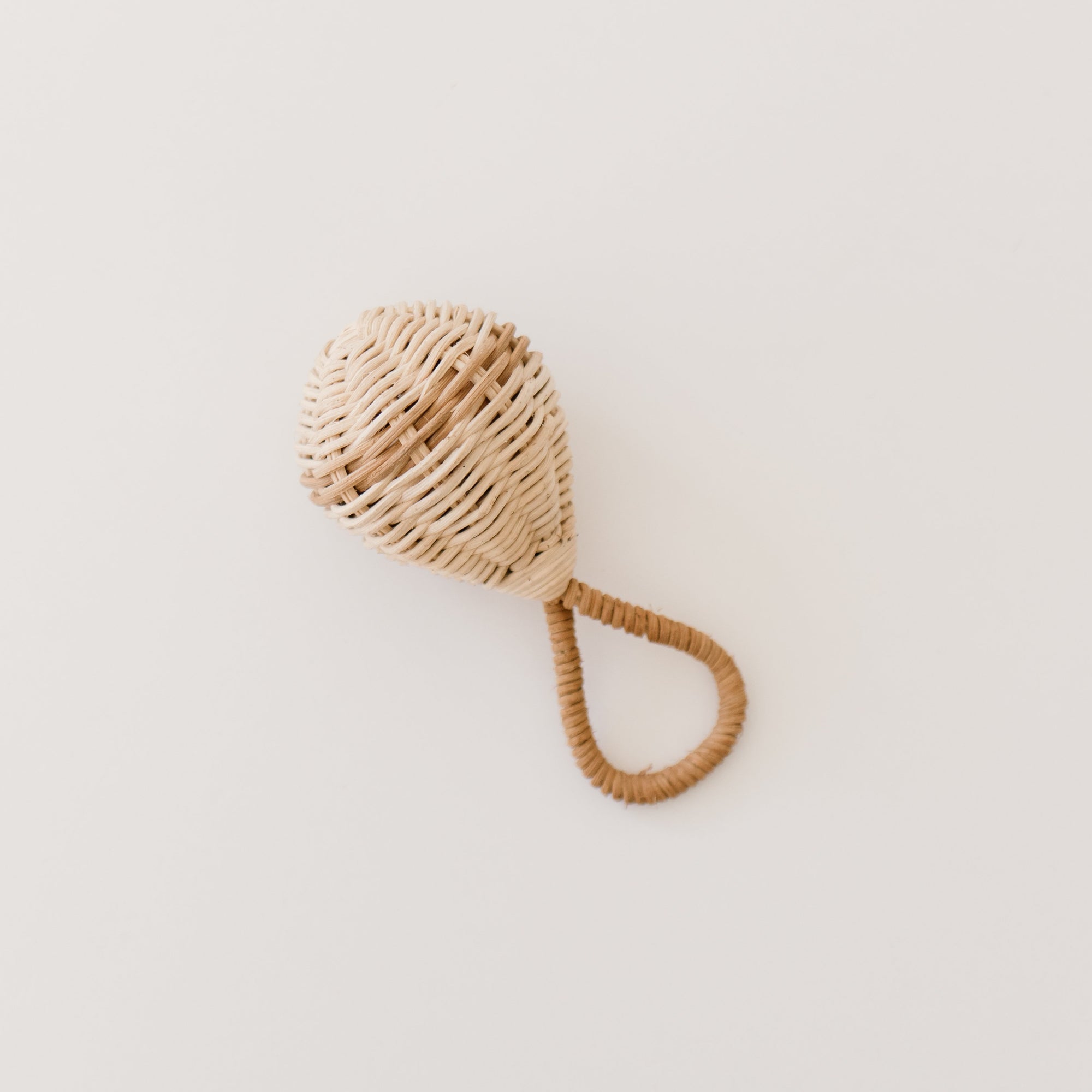 The Raya Rattle is handmade from 100% natural Rattan and has the loveliest of jingles from the bell inside. Beautiful and tactile, use your favourite natural fibres to hang the Raya Rattle from the handle of our Lyra Moses Basket to keep your little one entertained. A piece that will surely be treasured for years to come.