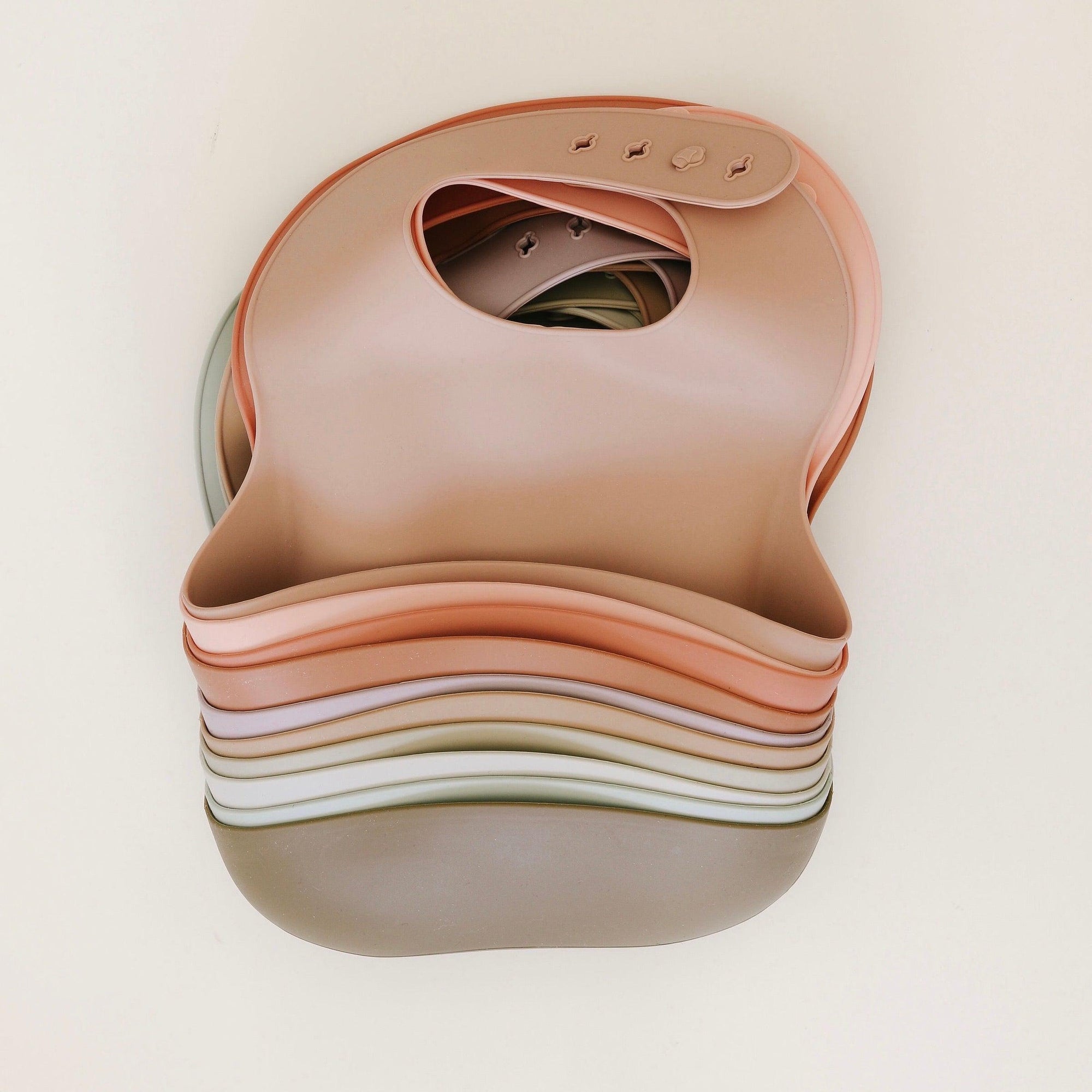 Rommer bibs are made from the softest silicone. They are both lightweight and durable. Rommer has updated the bib design to feature the reinforced button holes making them more resistant to tears.