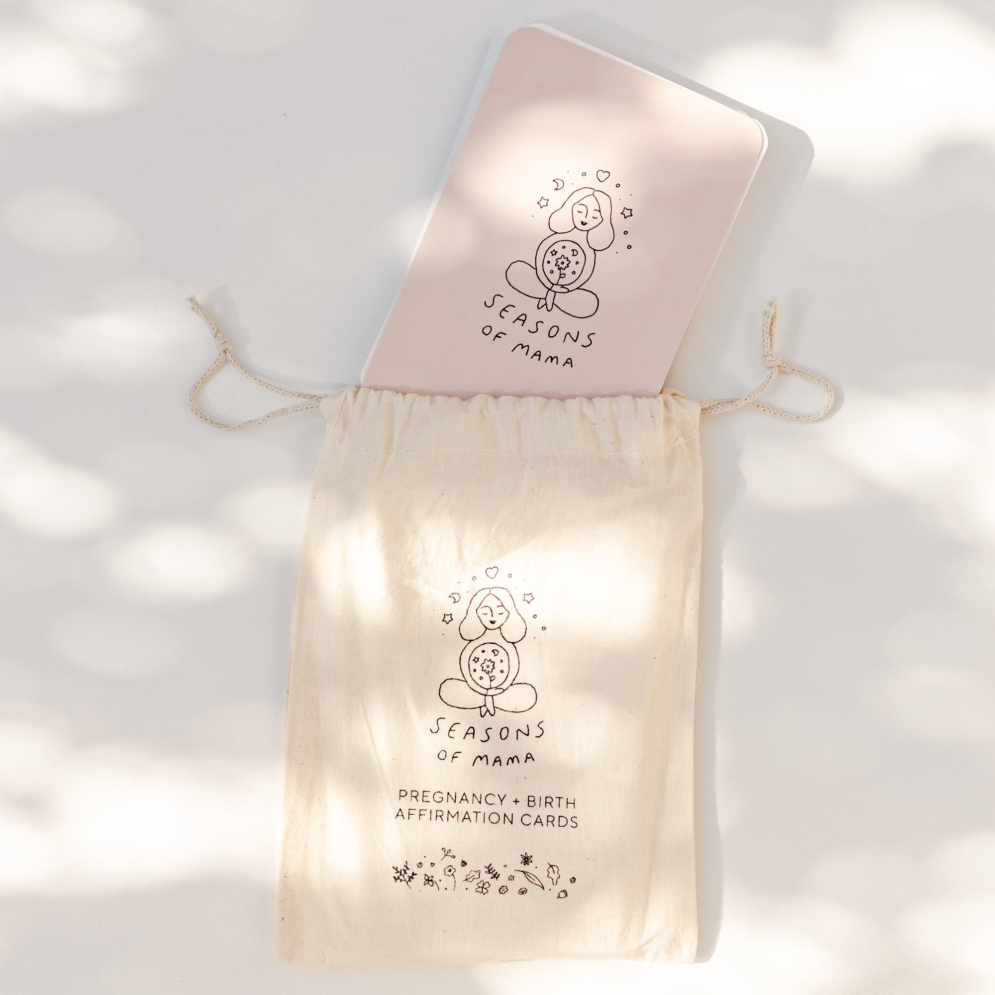 A Seasons of Mama branded calico bag with Birth Affirmation Cards by Seasons of Mama.
