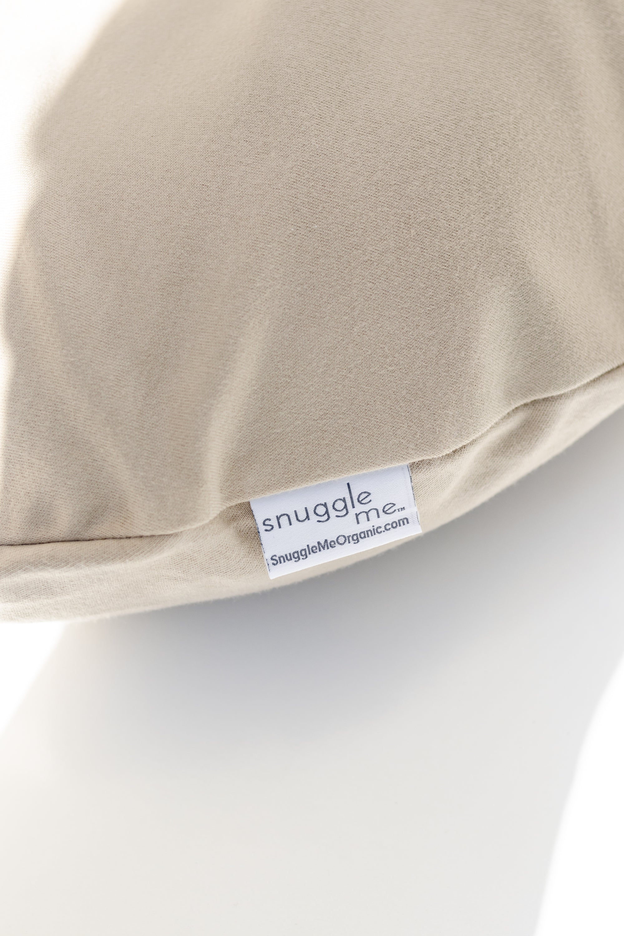 Snuggle Me Lounger Cover in the shade birch on a white surface.