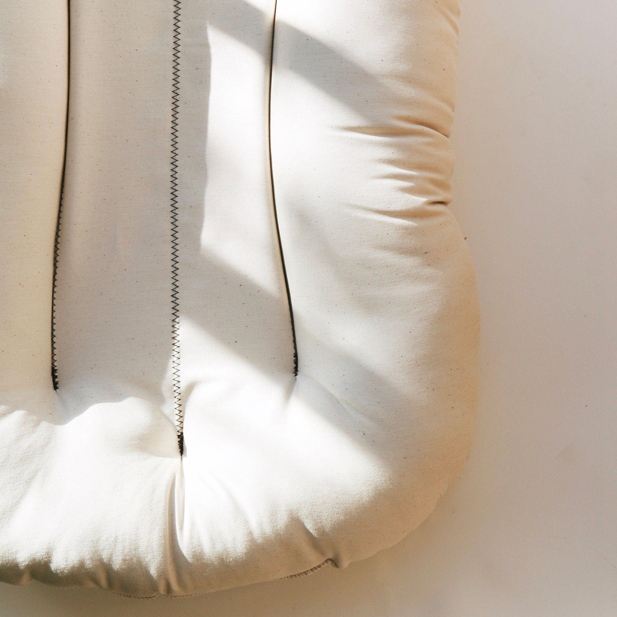 A close up image of The Snuggle Me® Lounge.