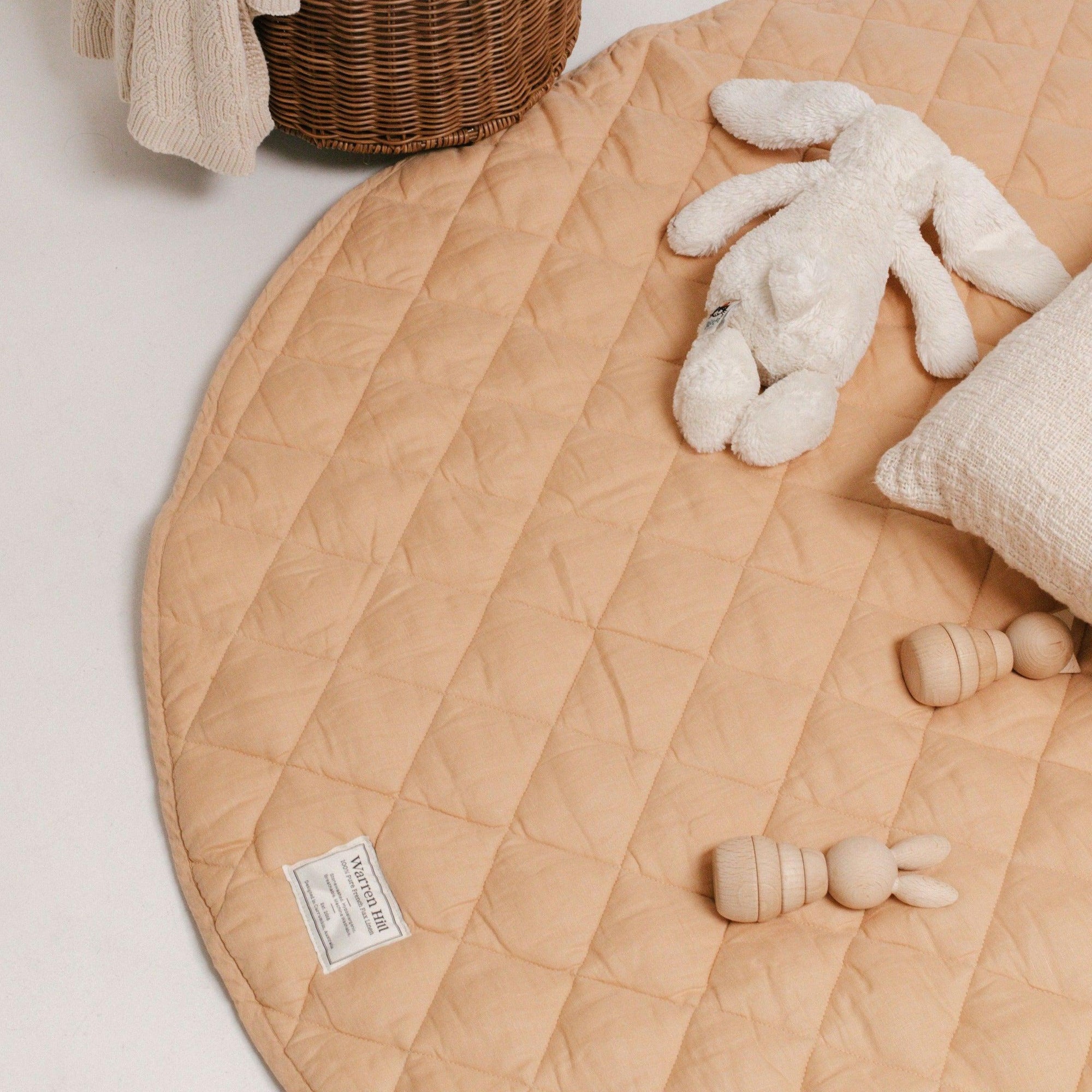 Our Warren Hill baby play mat is made from 100% Pure French Flax Linen with a soft, polyester filling that provides cushion and support for your child's delicate skin. Our linen is stonewashed giving it that beautiful soft, worn-in feel from the first time your child plays on it. Linen is naturally hypoallergenic, extremely durable, and one of the most sustainable materials to harvest and produce in the textile industry.