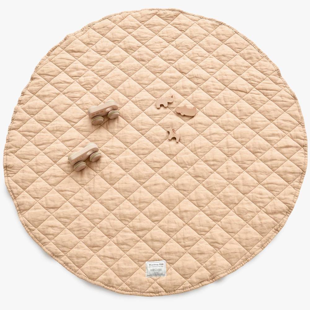 Our Warren Hill baby play mat is made from 100% Pure French Flax Linen with a soft, polyester filling that provides cushion and support for your child's delicate skin. Our linen is stonewashed giving it that beautiful soft, worn-in feel from the first time your child plays on it. Linen is naturally hypoallergenic, extremely durable, and one of the most sustainable materials to harvest and produce in the textile industry.