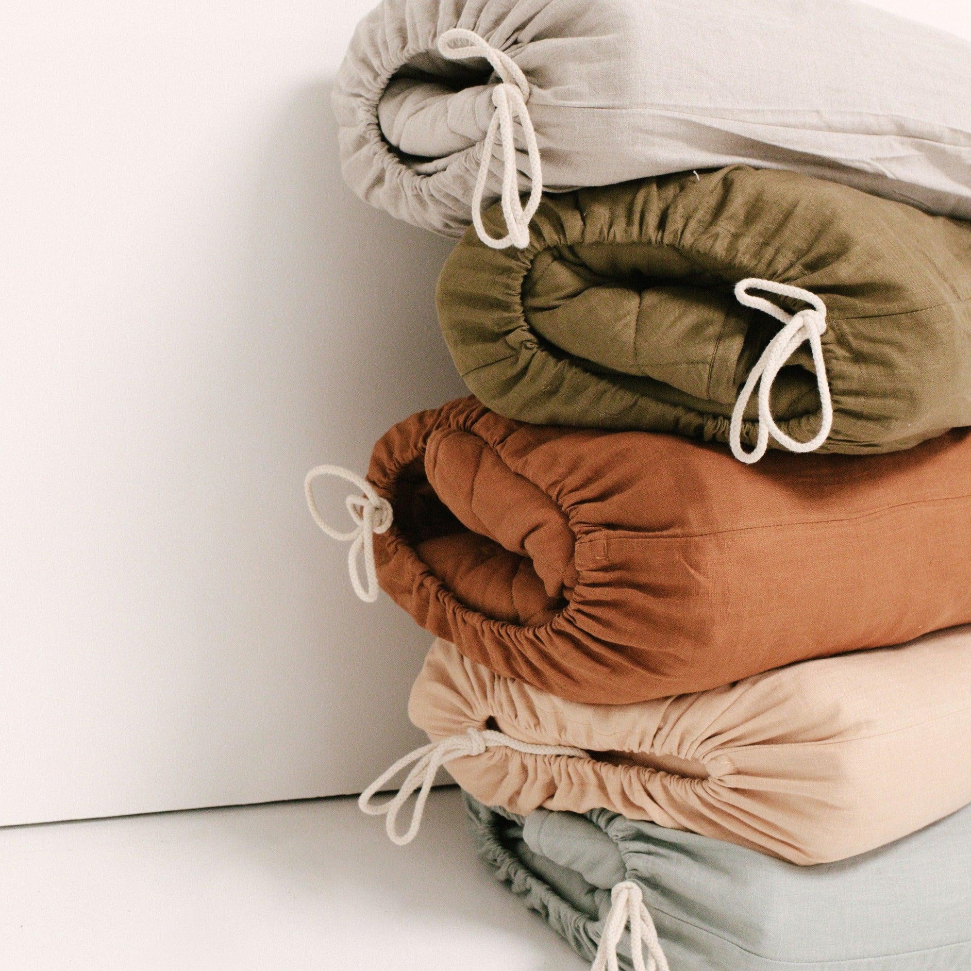 Our Warren Hill baby play mat is made from 100% Pure French Flax Linen with a soft, polyester filling that provides cushion and support for your child's delicate skin. Our linen is stonewashed giving it that beautiful soft, worn-in feel from the first time your child plays on it. Linen is naturally hypoallergenic, extremely durable, and one of the most sustainable materials to harvest and produce in the textile industry.