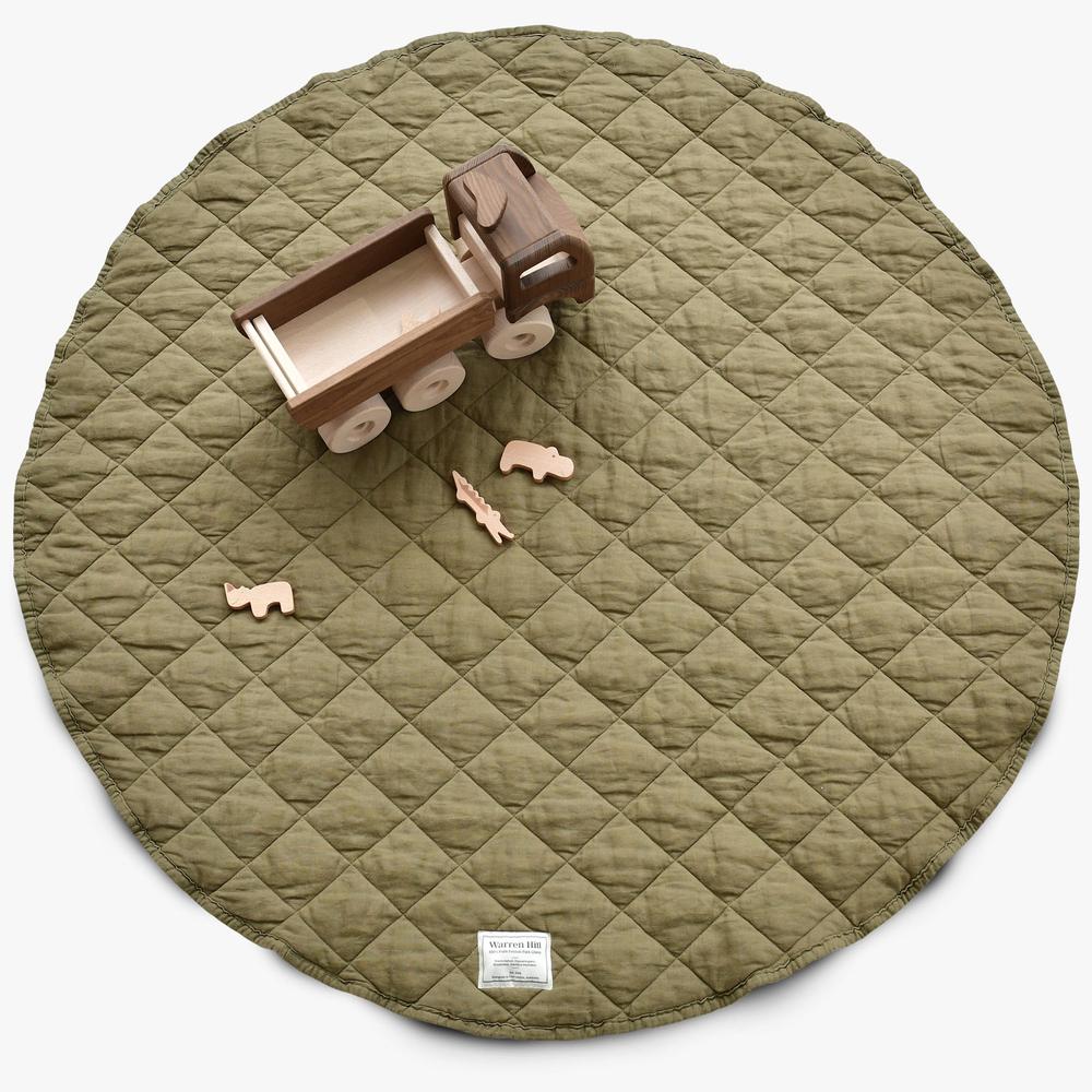 Our Warren Hill baby play mat is made from 100% Pure French Flax Linen with a soft, polyester filling that provides cushion and support for your child's delicate skin. Our linen is stonewashed giving it that beautiful soft, worn-in feel from the first time your child plays on it. Linen is naturally hypoallergenic, extremely durable, and one of the most sustainable materials to harvest and produce in the textile industry.