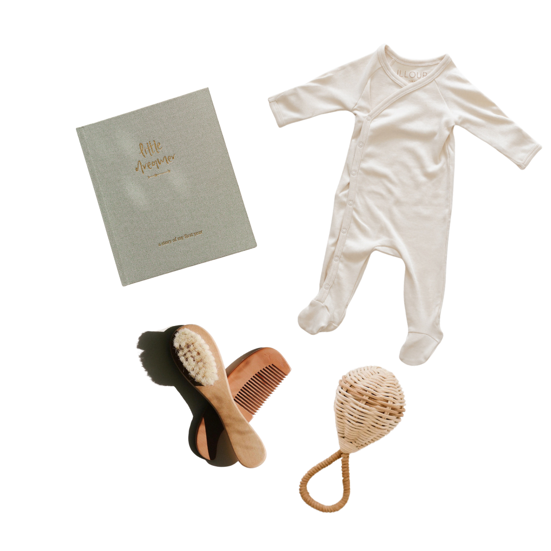 A heartwarming set featuring "baby's first Christmas gift set" by biglittlethings, including a baby's outfit and other items, perfect for baby's first Christmas.