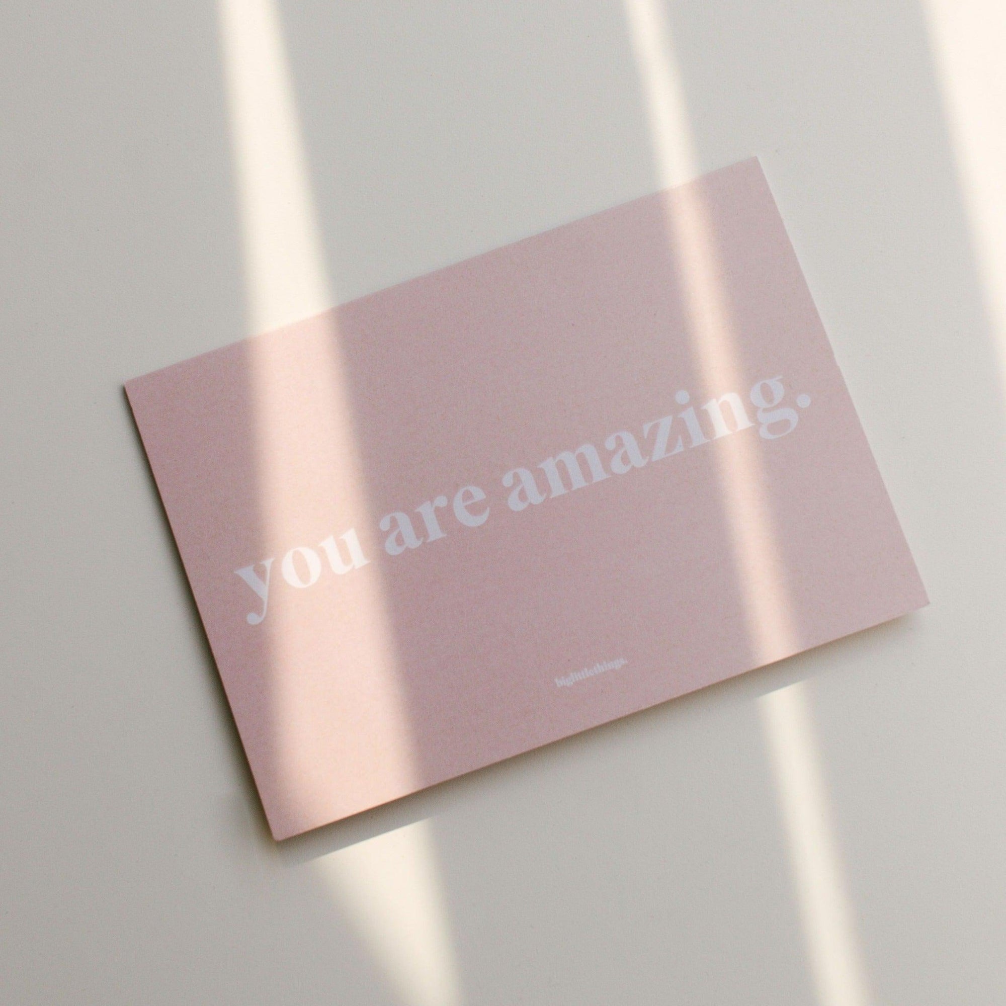 A pink greeting card with the words "you are amazing" by biglittlethings.