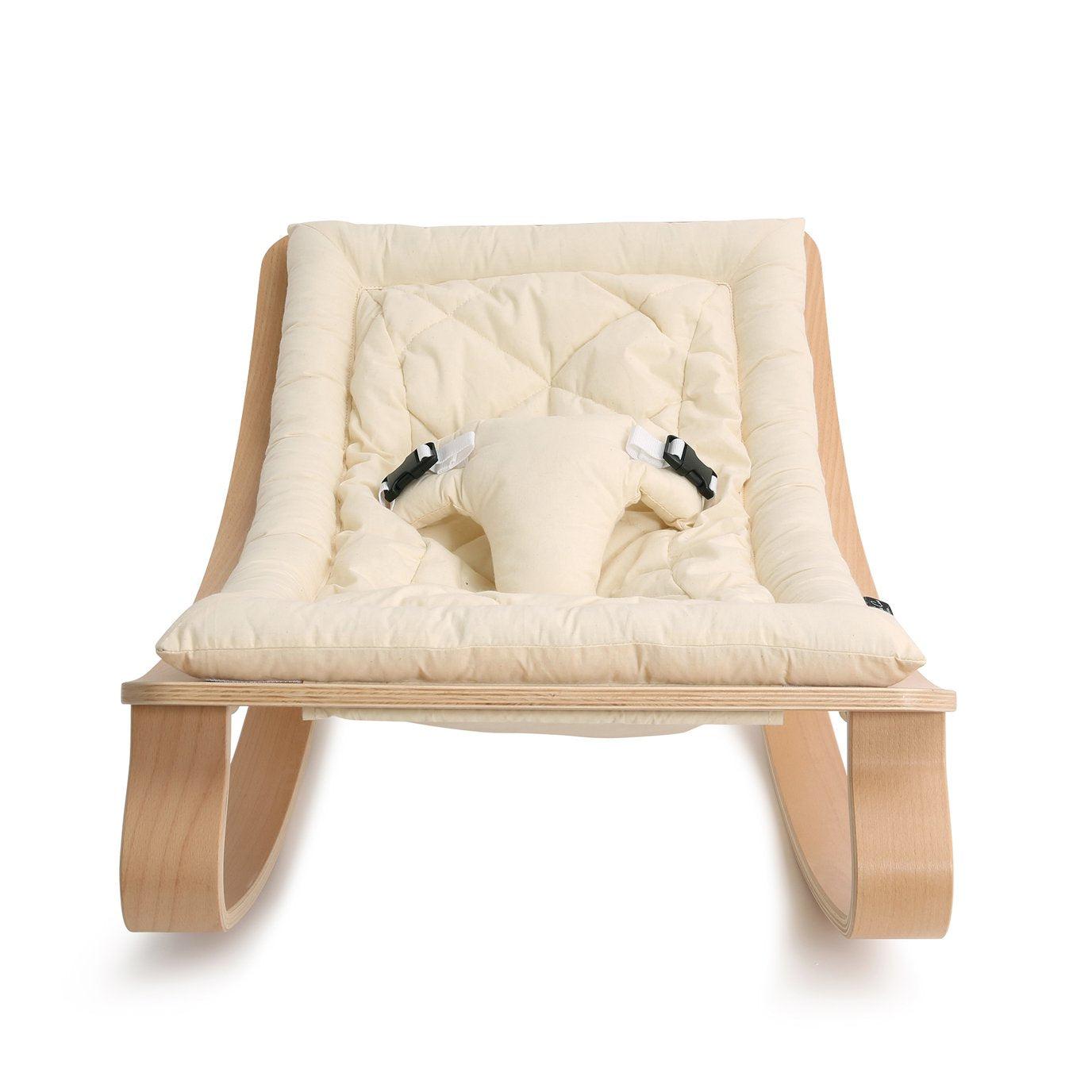 A wooden Levo Rocker by Charlie Crane with a white background.