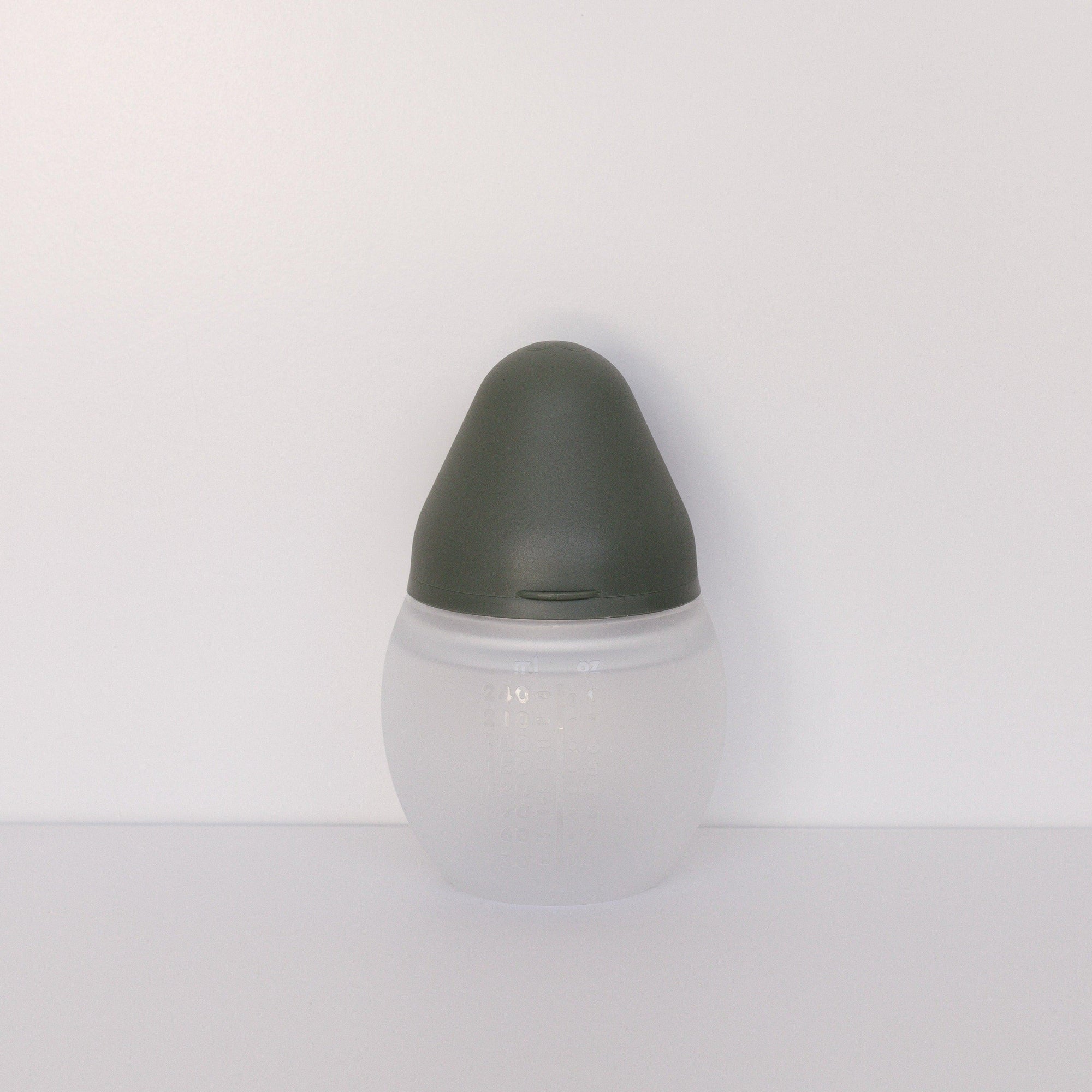 A BibRond khaki bottle from Elhée France standing against a white surface.