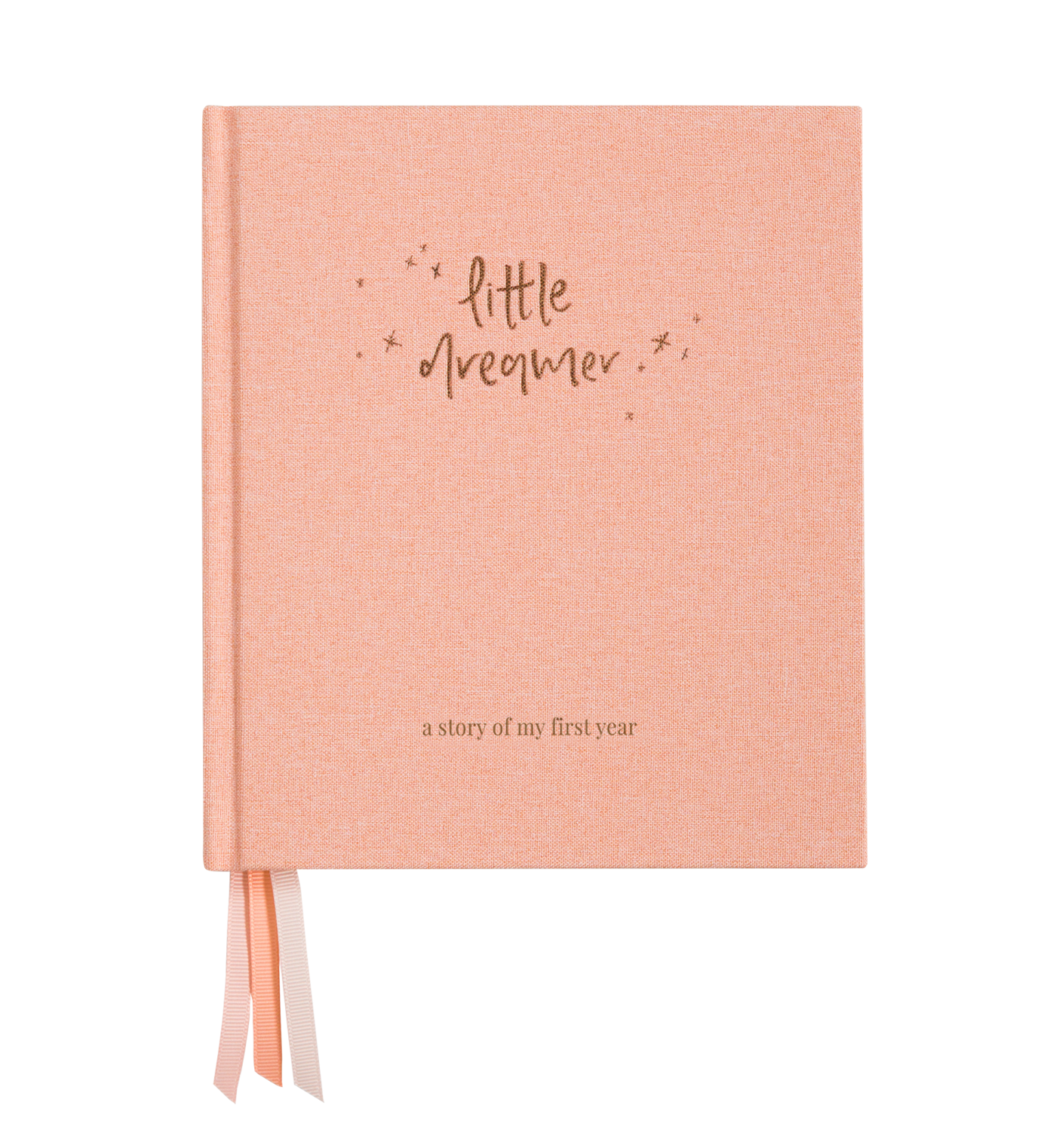 An Emma Kate Co. little dreamer baby journal in petal on a transparent surface.