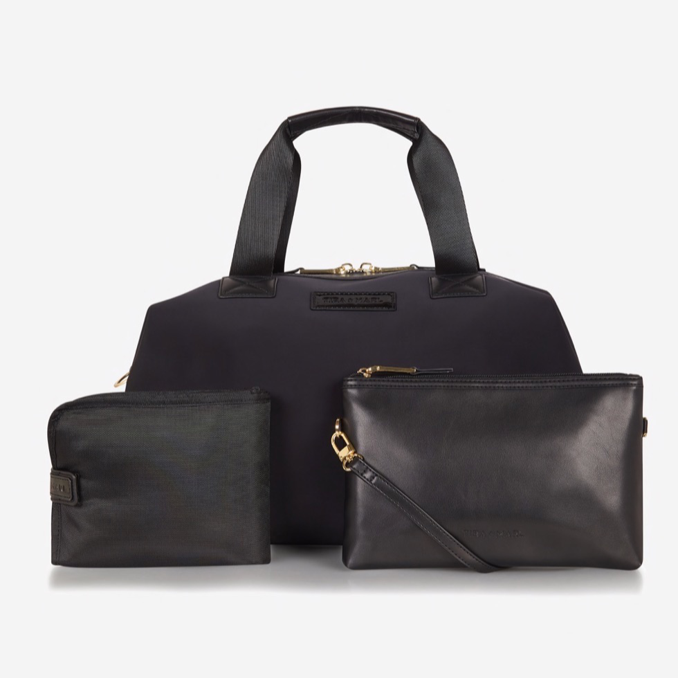 A sleek and compact every-day version of our best selling RAF WEEKENDER. Smaller but perfectly formed and includes all original internal functionality.   This hard-working holdall gets a sports-lux make-over in sleek Black scuba fabric, paired with lux gold hardware. The perfect size to fit all your essential items for a day out, it also doubles up as a stylish work bag, hand bag or overnight bag.